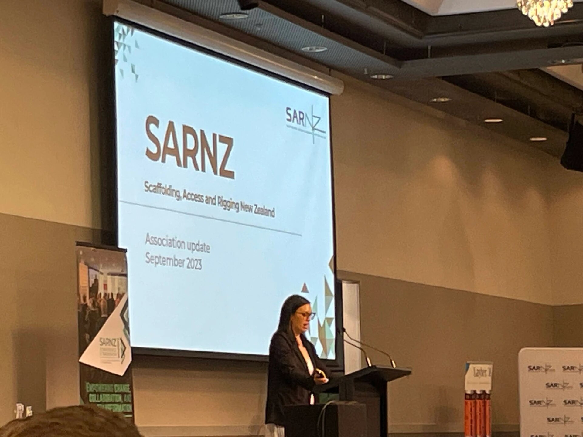 A speaker presenting a SARNZ association update at the 2023 conference